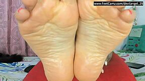 colombian latina femdom jerks you off with confident barefoot toes and feet tease