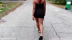 Pretty girl in sexy dress poses outdoors by impala car
