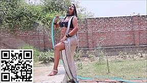wet saree hugs curves in teasing indian shower drip
