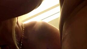 Blonde milf with big tits blows in mall restroom