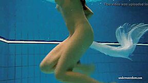 kristy teases huge tits underwater in bikini pool