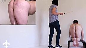 Part 1 slave bound in cage endures caning and fisting