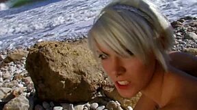 tattooed blonde mom rides big cock on sunny beach