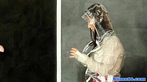 This heeled bukkake babe masturbates at gloryhole