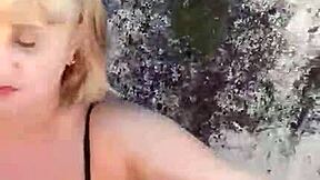 african milf shows off huge natural tits and big pussy lips on beach