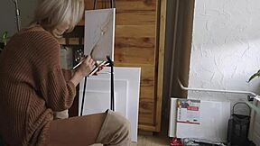 cute blonde babe paints her pretty pussy flower wearing sexy boots glasses