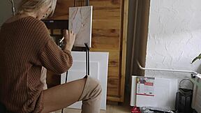 cute blonde babe paints her pretty pussy flower wearing sexy boots glasses