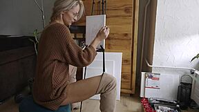 cute blonde babe paints her pretty pussy flower wearing sexy boots glasses