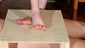 mistress stomps slave cock bare feet then footjobs him hard
