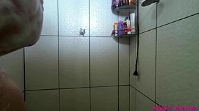 Curvy latina gym babe with huge natural tits caught on bathroom camera