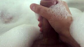 she relaxes in bubble bath fingering her wet pussy solo