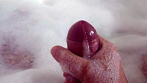 she relaxes in bubble bath fingering her wet pussy solo