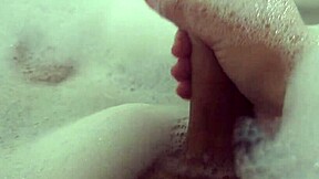 she relaxes in bubble bath fingering her wet pussy solo