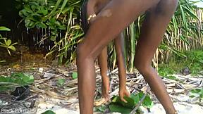 Skinny african girl prepares forest medicine bare for granny in the wild kitchen