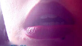 Matte red lipstick on milf lips. Brunette housewife smokes fetish style