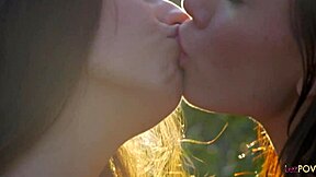 Two brunettes enjoy a romantic session kissing outdoors