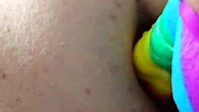 Chubby brunette gapes ass wide on massive rainbow dildo creampie