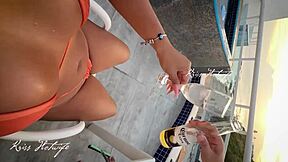 huge tanned puta wife shows off big pussy and ass in rooftop pool!