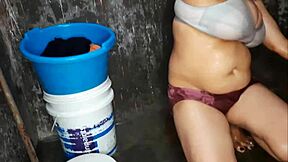 Curvy indian milf washes big shaved tits in steamy bath