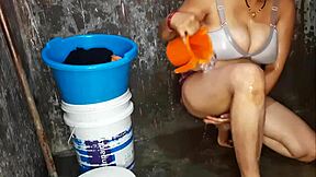 Curvy indian milf washes big shaved tits in steamy bath