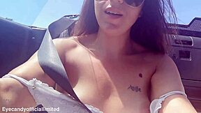 Naughty brunette flashes natural tits pussy from sports car top down