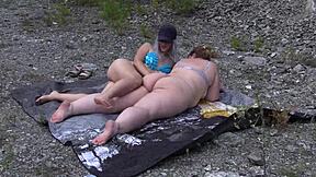 Two big ass lesbians grope juicy pussies outdoors in panties!