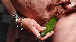 granny fucks her hairy pussy with a cucumber