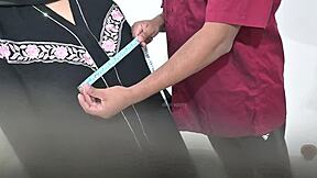 Doctor Examines Hijab-Clad Arab Patient