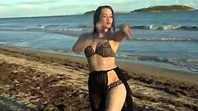 Hey, watch this sexy homemade belly dancer babe shake her big ass and natural tits wildly!