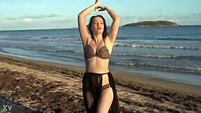 Hey, watch this sexy homemade belly dancer babe shake her big ass and natural tits wildly!