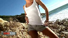 mysterious blonde nicky wayne strips bare by the crashing sea waves