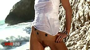 mysterious blonde nicky wayne strips bare by the crashing sea waves
