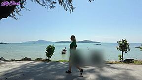 Pretty milf walks beach in dress buzzing from remote vibrator toys