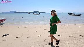 Pretty milf walks beach in dress buzzing from remote vibrator toys