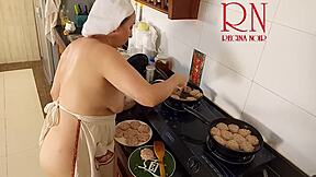 Nudist housewife bares all while cooking naked in kitchen