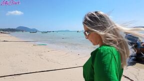 Pretty milf walks beach in dress buzzing from remote vibrator toys