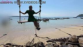 Pretty milf walks beach in dress buzzing from remote vibrator toys