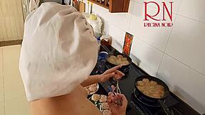 Nudist housewife bares all while cooking naked in kitchen