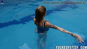 Ashlee Rose Teases Wet in Silver Underwater Dress