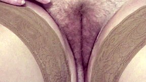 watch this real blonde milf frina finger her huge hairy wet pussy lips till she squirts hard on sofa in stockings