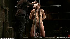 Redhead slave's neck trapped for brutal lesbian torment