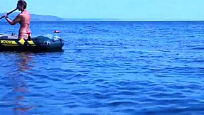 amateur mature woman poses erotically in bikini on boat floating volga river outdoors