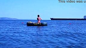 amateur mature woman poses erotically in bikini on boat floating volga river outdoors