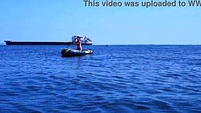 amateur mature woman poses erotically in bikini on boat floating volga river outdoors