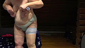 a chubby russian milf in stockings masturbates with dildo on cam