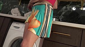 Hot Brunette Babe Flashes Panties in Kitchen. Slips Them Off Under Miniskirt for Shaved Pussy Reveal