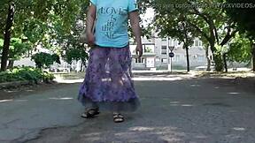 Hairy mature flashes plump pussy through see-through dress outdoors